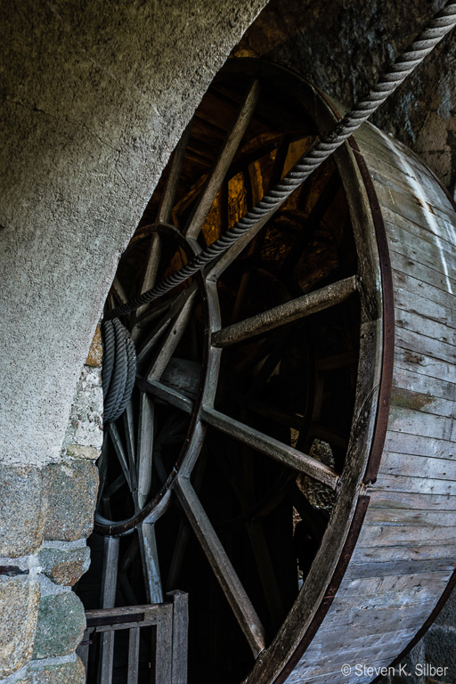Winch used to raise supplies - men walked inside the wheel to turn it. (1/10 sec at f / 8.0,  ISO 500,  18 mm, 18.0-55.0 mm f/3.5-5.6 ) May 12, 2017